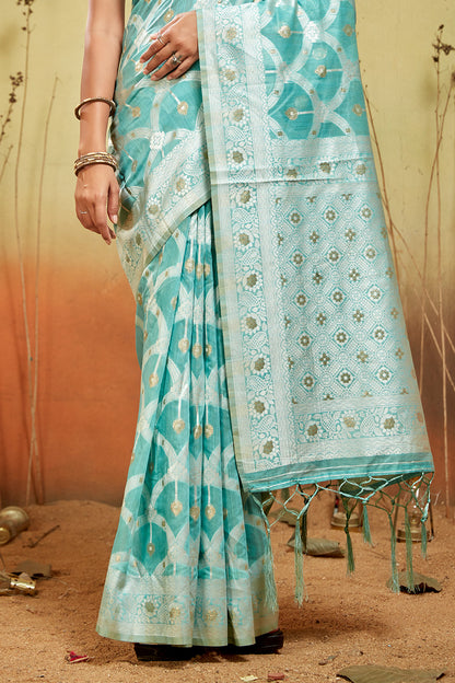 Sea green organza saree with silver zari detail