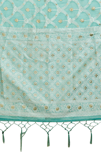 Sea green organza saree with silver zari detail